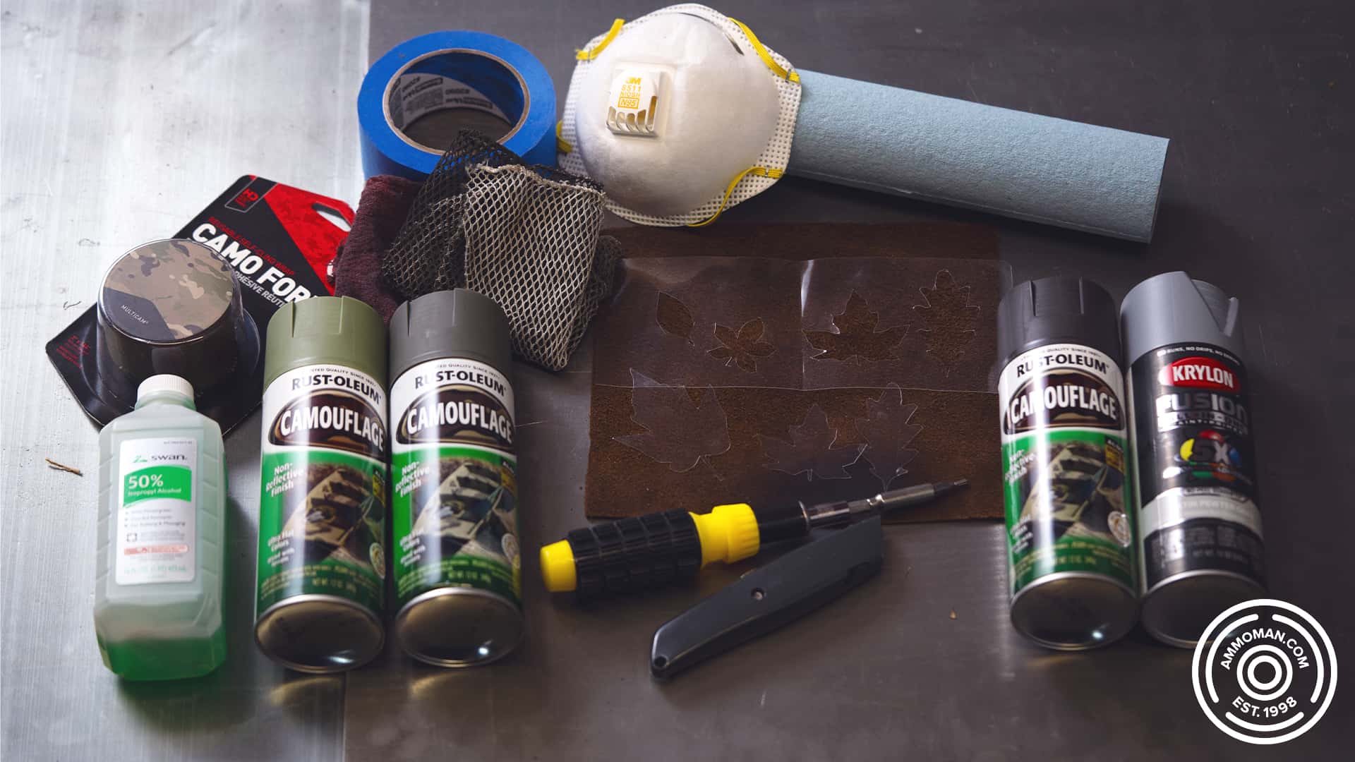 a photo of various painting supplies laying on a table used to paint a rifle