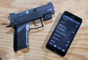 Mantis X10 system and pistol and app for a smartphone displayed