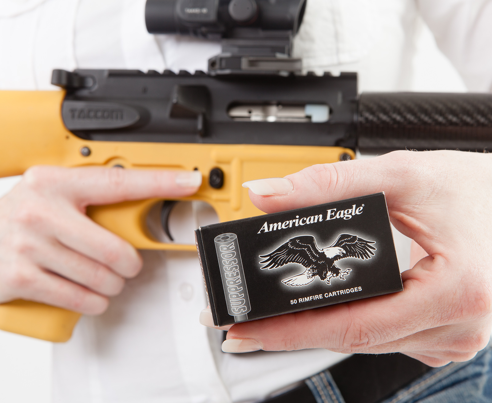 Federal Subsonic 22LR ammo with an AR-style rifle on display